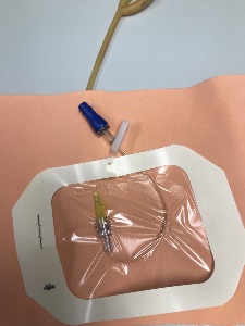 IV extension tube attached to simulated skin with tegaderm