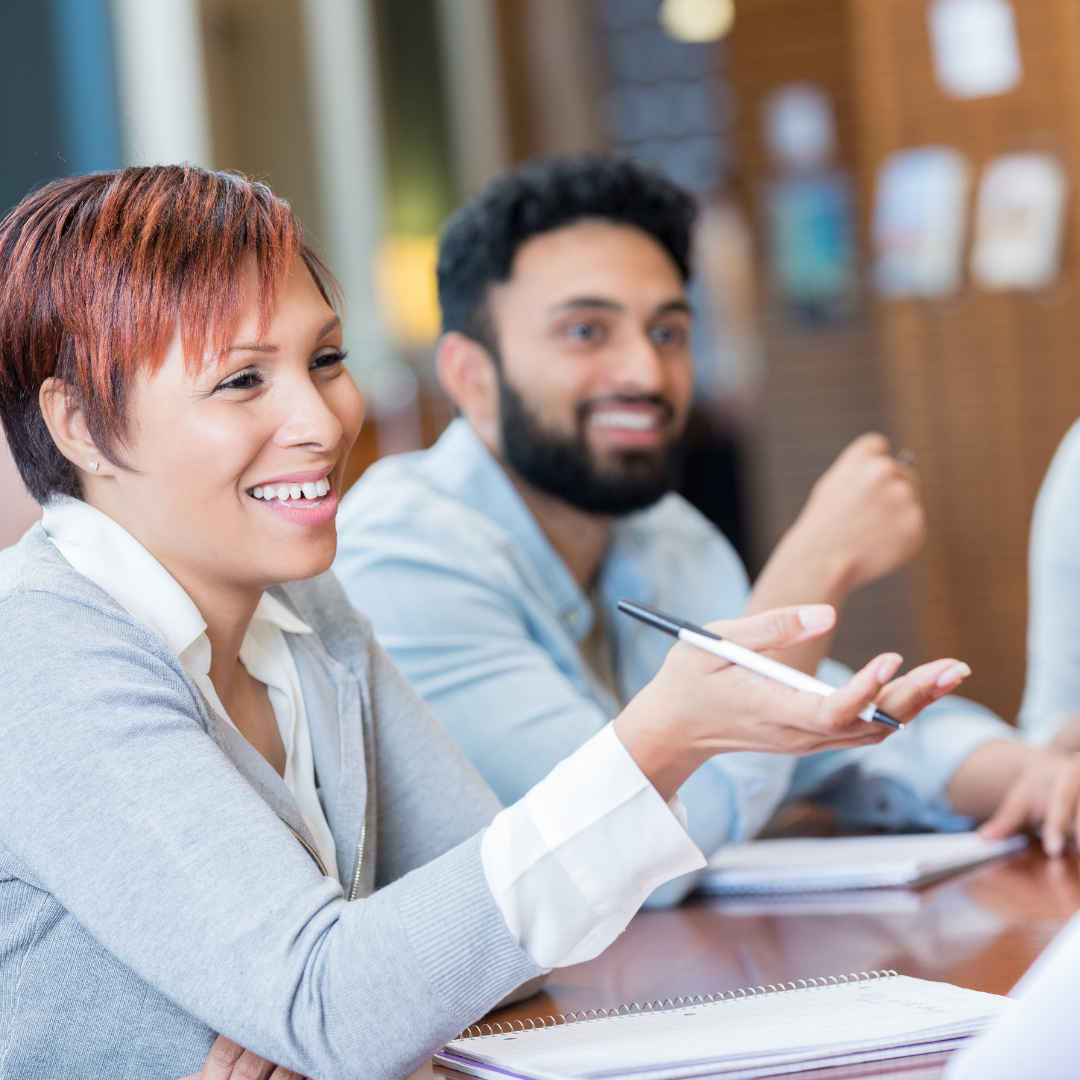 People at a table engaged in a lively conversation