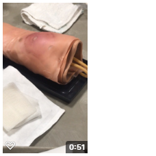 IV training arm with simulated reddish brown abscess