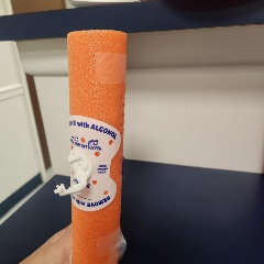 12-inch section of orange pool noodle statlock attached