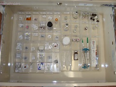 close-up of first drawer in beige medical cart showing medications neatly aligned