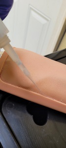 application of the silicone glue to the IV trainer