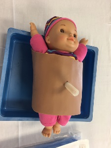 newborn body form with simulated skin wrapped about the torso and a simulated umbilicus