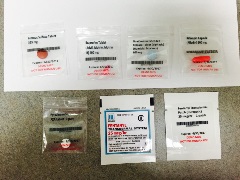 Five 2" x 2" clear plastic zippered bags with tablets and two white fentanyl transdermal patches