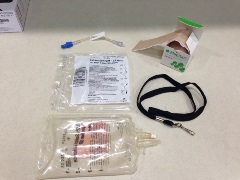 J-loop, extension tubing set, mepitac tape, empty IV fluid bag, lanyard