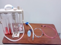 chest drainage collection system with Jackson-Pratt drain, wound kit tubing, and nasal cannula tubing