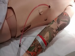 side view of manikin torso with simulated chest tube