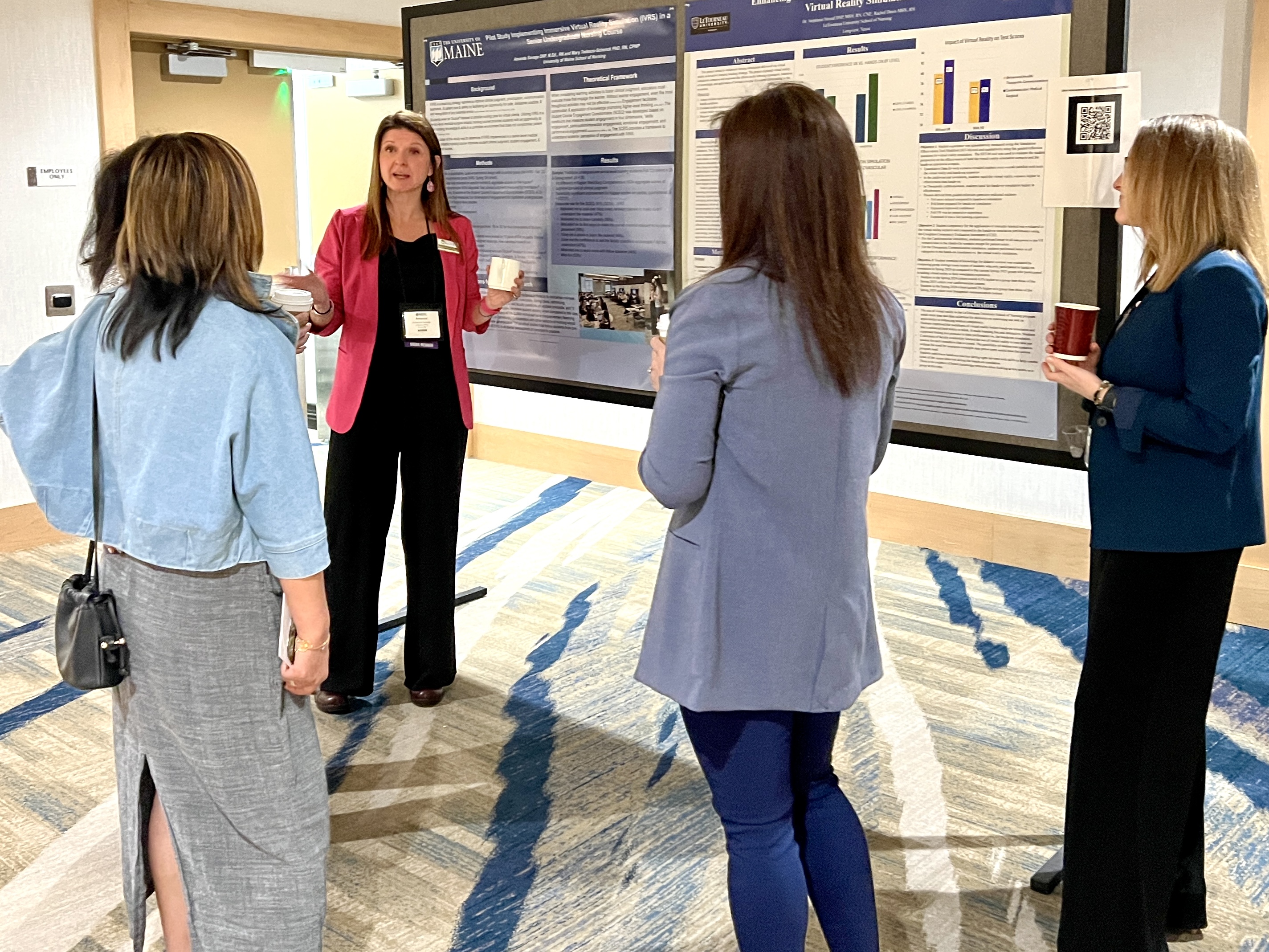 NERC poster presentation A nurse educator discusses their poster presentation with colleagues