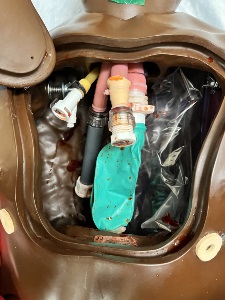 inside manikin chest showing connectors with droplets of simulated blood