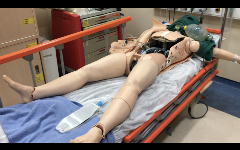 full size manikin on gurney with chest cavity open