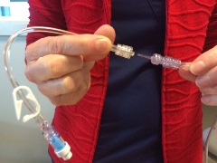 woman connecting IV extension